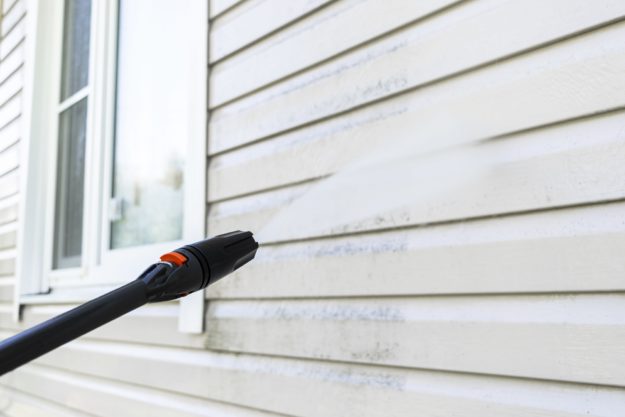 power washing siding of a house | power washing a house