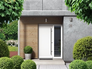 Modern home facade with entrance, front door and view to the garden | pressure washing tips