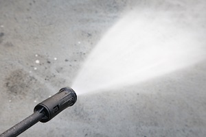 Water hose spray gun washing cement floor | power washing vs pressure washing