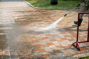 outdoor floor cleaning with a pressure water jet on street | pressure washing vs power washing