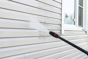 cleaning dirty wall with high pressure water jet | power washing your house