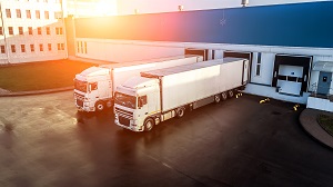 trucks loaded in a logistics center | commercial warehouse cleaning