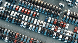 tight coloured finished car rows on parking area with modern lighting on sunny summer day vertical upper view | maintain commercial shopping center