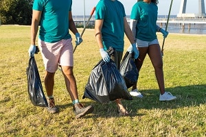 volunteers cleaning park area from rubbish | cleaning services for long-term care facilities
