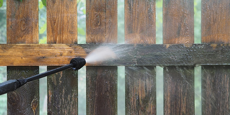 pressure washing a fence